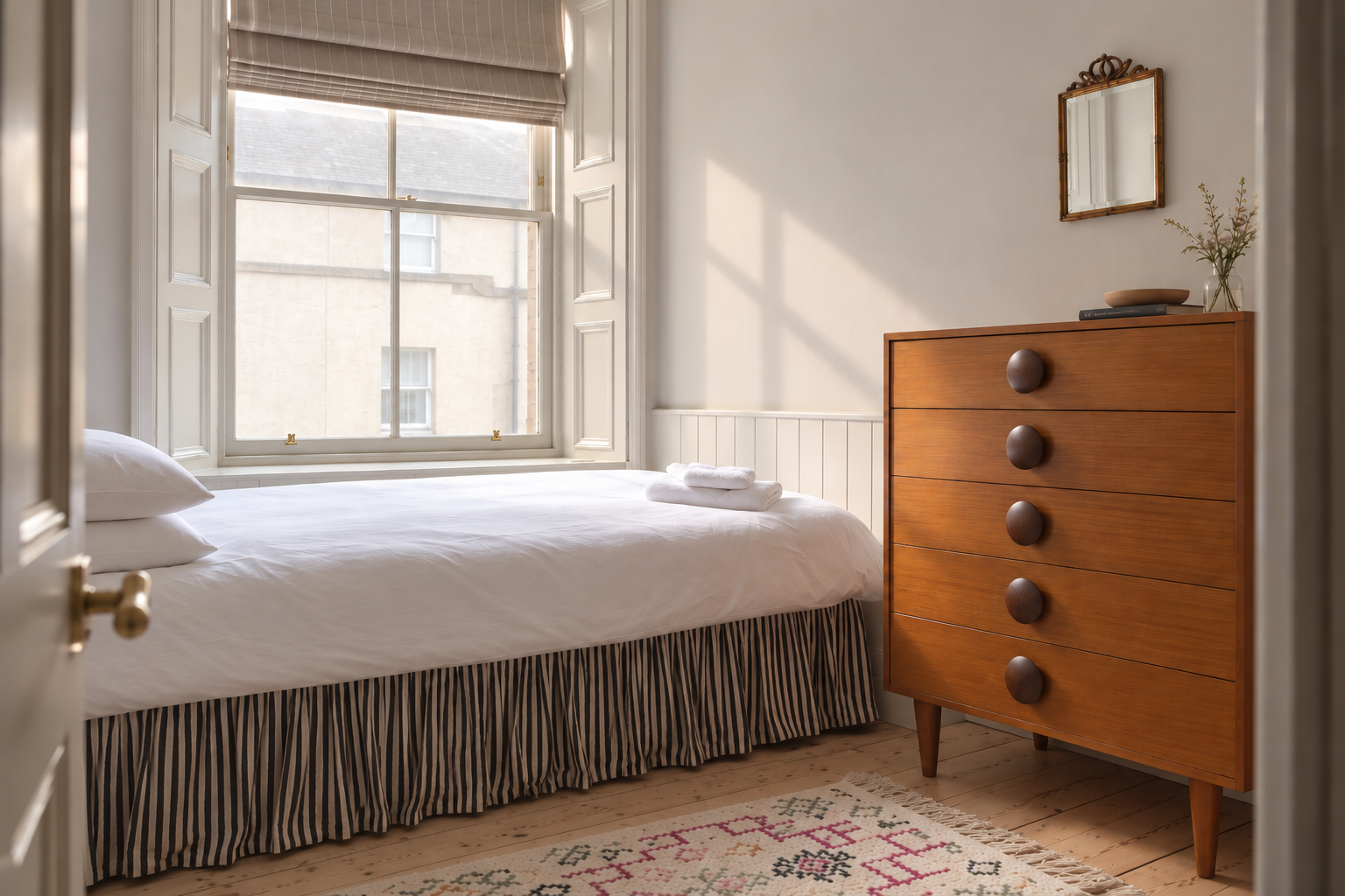 Bright and cozy bedroom with natural light and stylish vintage touches