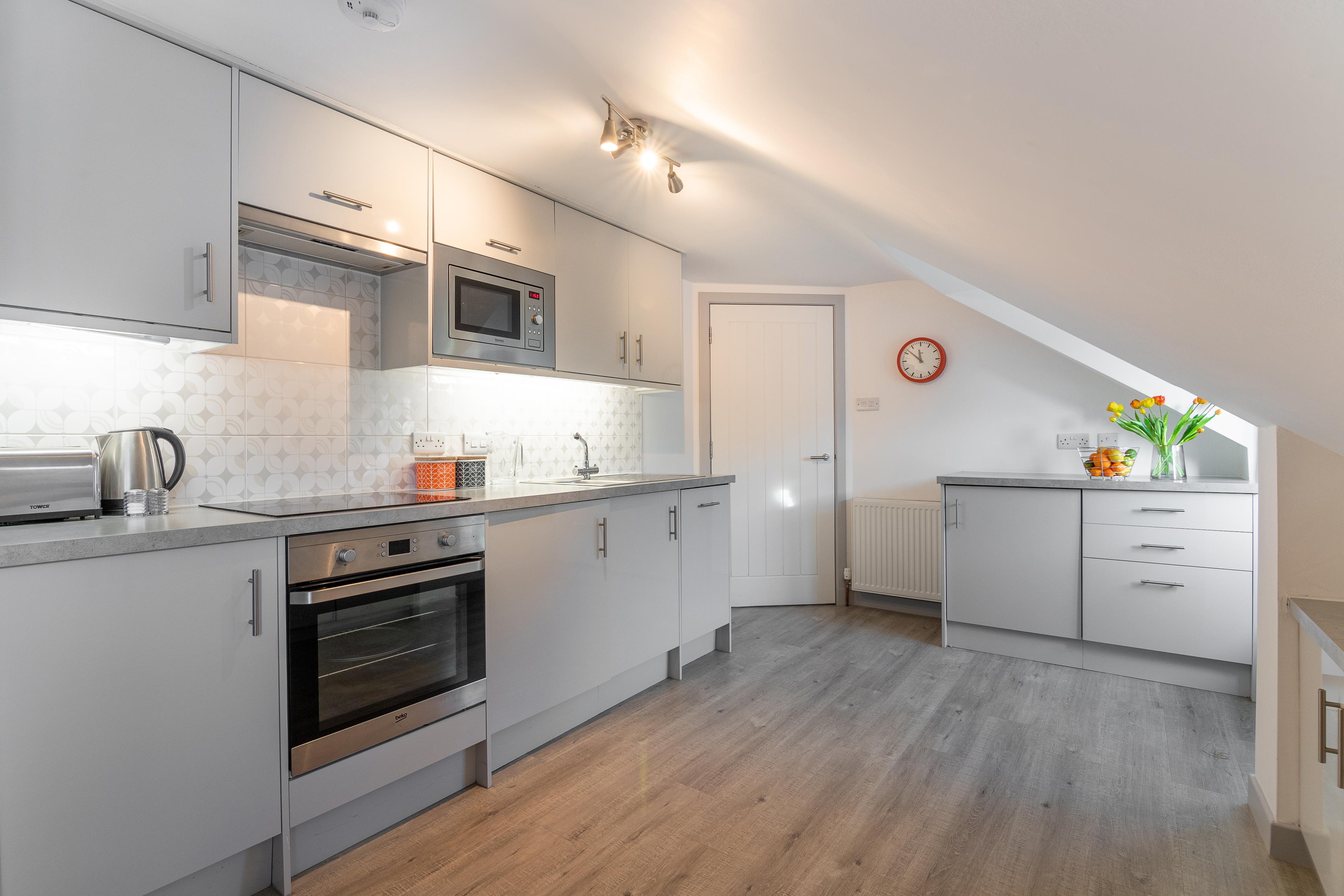 Bright modern kitchen with sleek appliances and stylish finishes